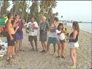 Sharing the coconut: Tom, Callie, Don, John, Uncle John, Jim, Tisa, and Kalyn